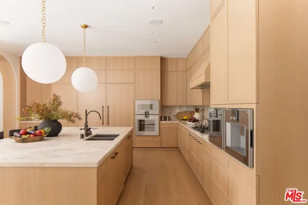 a kitchen with counter top space and a sink