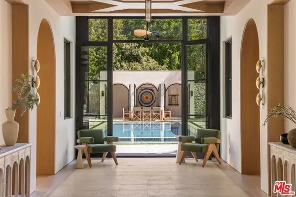 a view of front door with outdoor seating