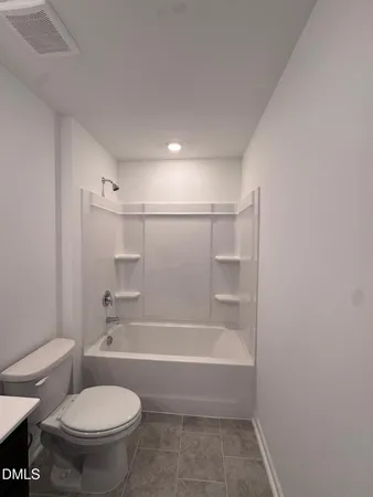 a view of storage and utility room with washer and dryer
