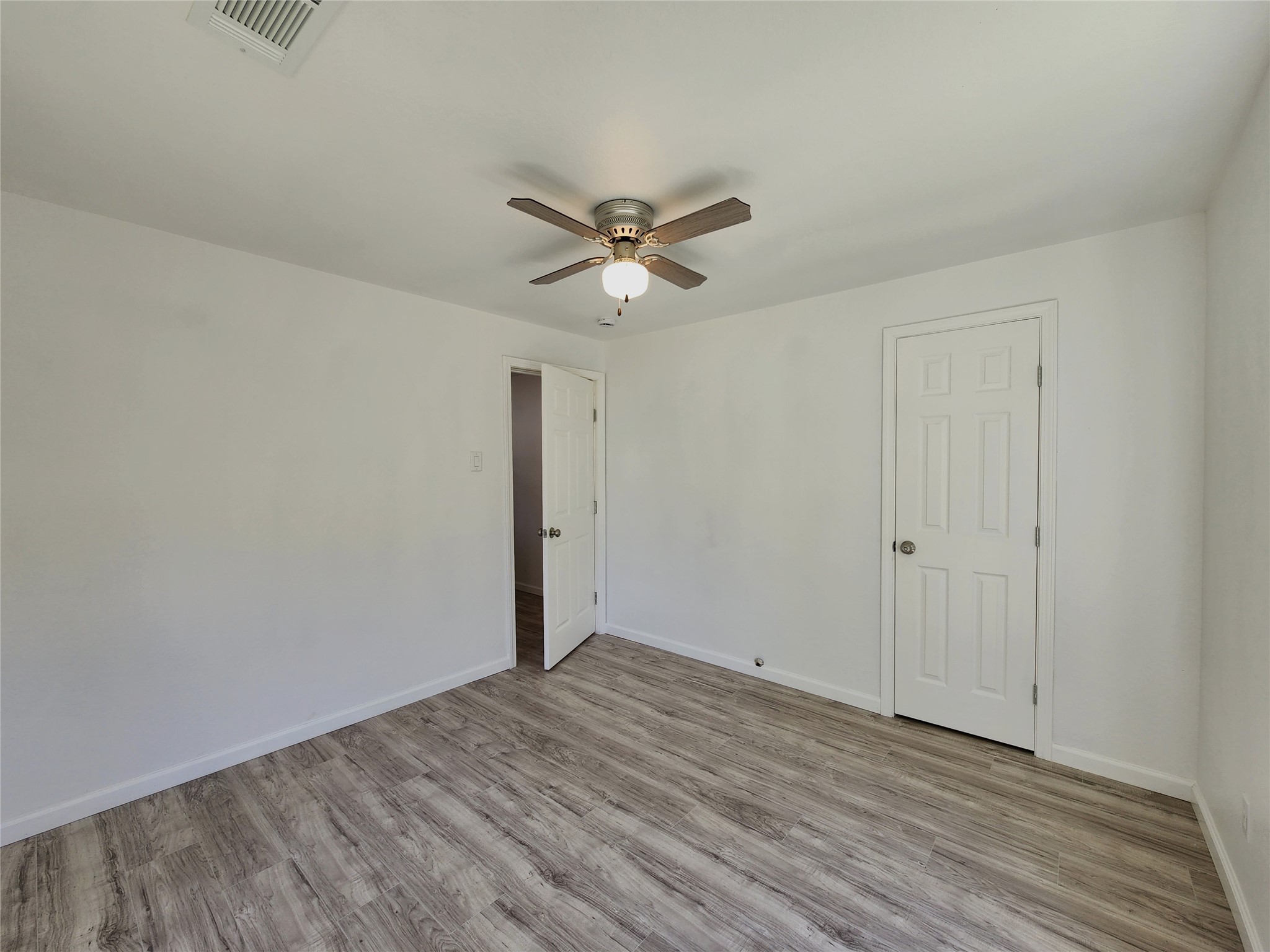 2706 Berry Street, Unit B Houston, TX 77004 - Photo 4 of 9 wooden floor in an empty room