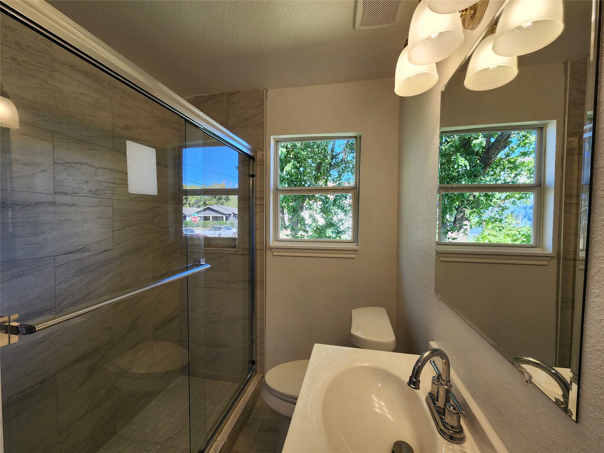 2706 Berry Street, Unit B Houston, TX 77004 - Photo 7 of 9 a bathroom with a sink a mirror and a bathtub