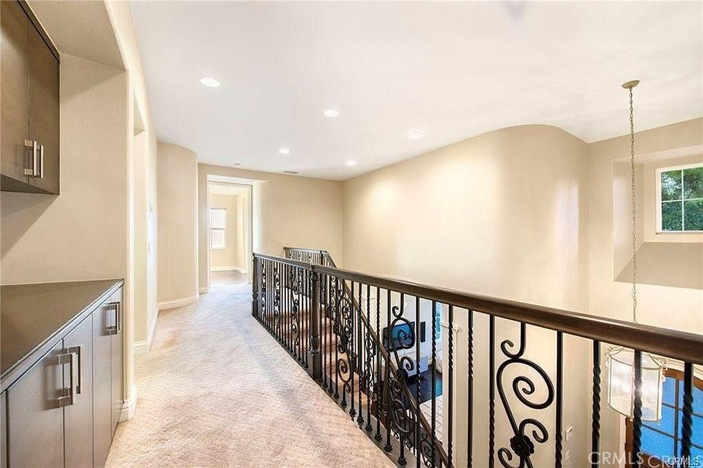 32 Walnut Creek Irvine, CA 92602 - Photo 15 of 24 a view of a hallway with windows