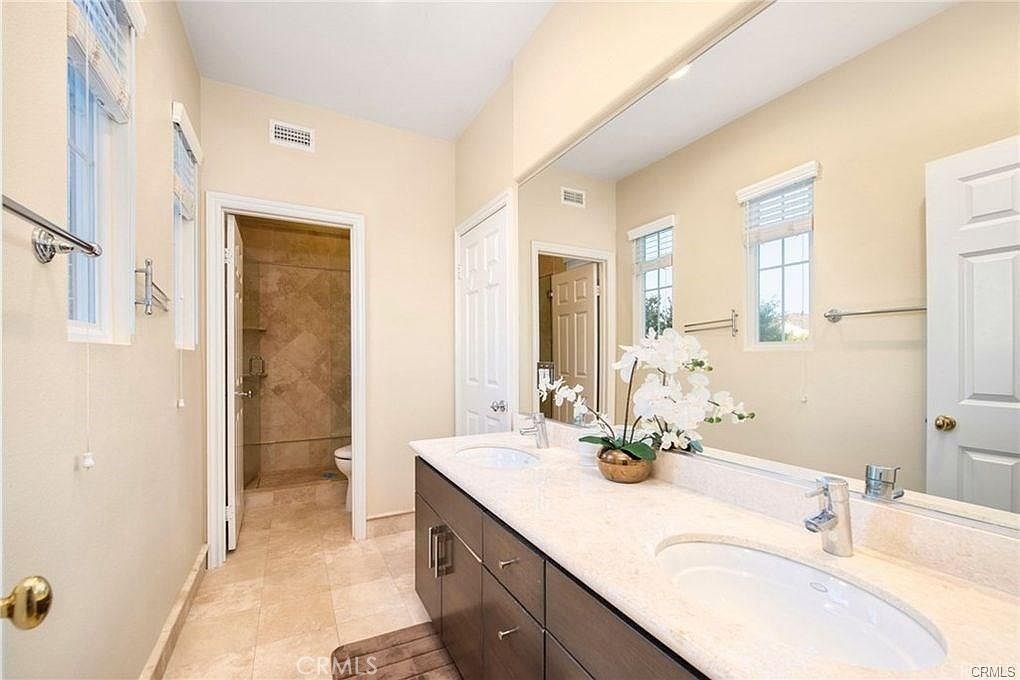 32 Walnut Creek Irvine, CA 92602 - Photo 19 of 24 a bathroom with a double vanity sink mirror and double