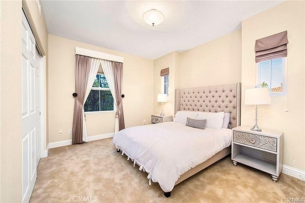 32 Walnut Creek Irvine, CA 92602 - Photo 20 of 24 a bedroom with a bed wooden floor and window