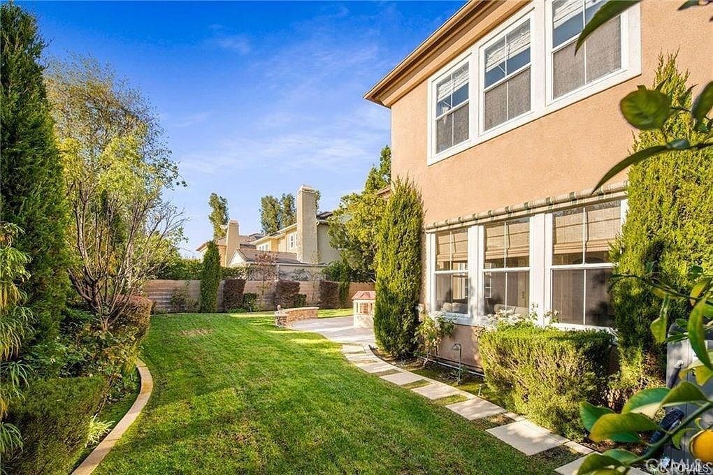 32 Walnut Creek Irvine, CA 92602 - Photo 23 of 24 a view of a building with a yard