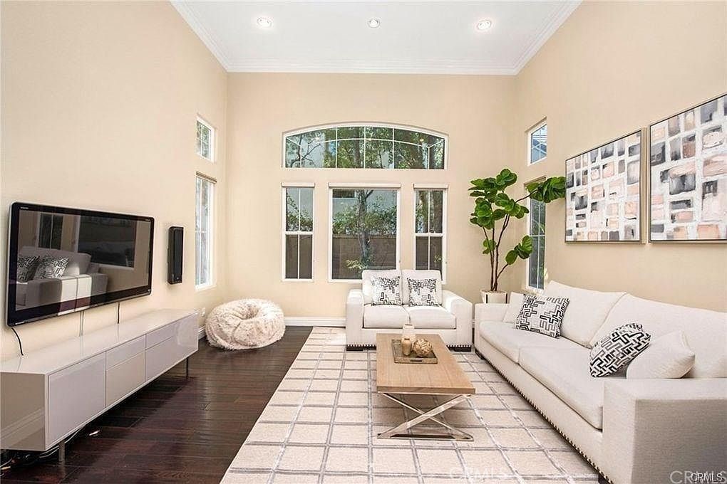 32 Walnut Creek Irvine, CA 92602 - Photo 5 of 24 a living room with furniture and a flat screen tv