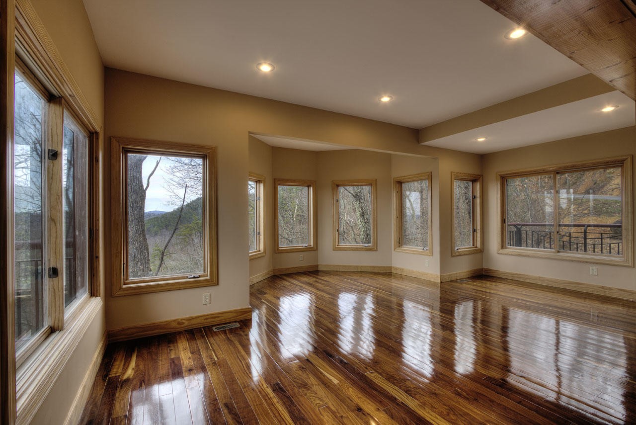 2602 Sharpes Ridge Way Sevierville, TN 37876 - Photo 16 of 28 a view of empty room with wooden floor and fan