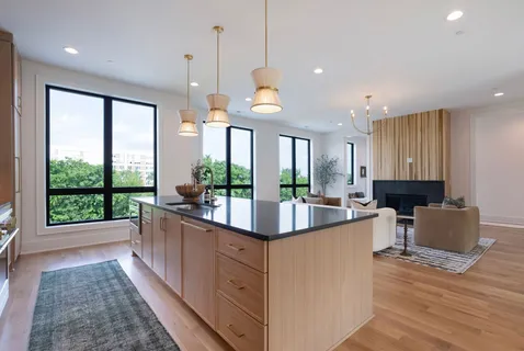a large kitchen with lots of counter space and a sink