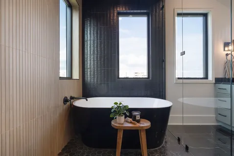 a house view with swimming pool in front of it