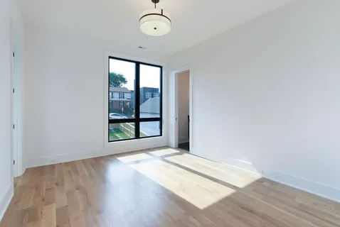 an aerial view of a house with outdoor space and lake view