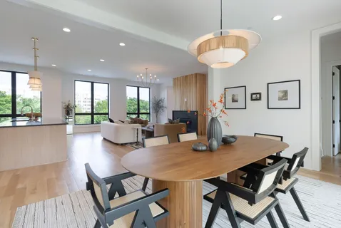 a kitchen with stainless steel appliances granite countertop white cabinets and sink