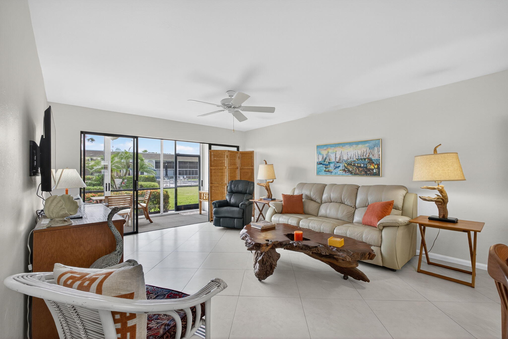755 Saturn Street, Unit C105 Jupiter, FL 33477 - Photo 15 of 36 a living room with furniture and a large window