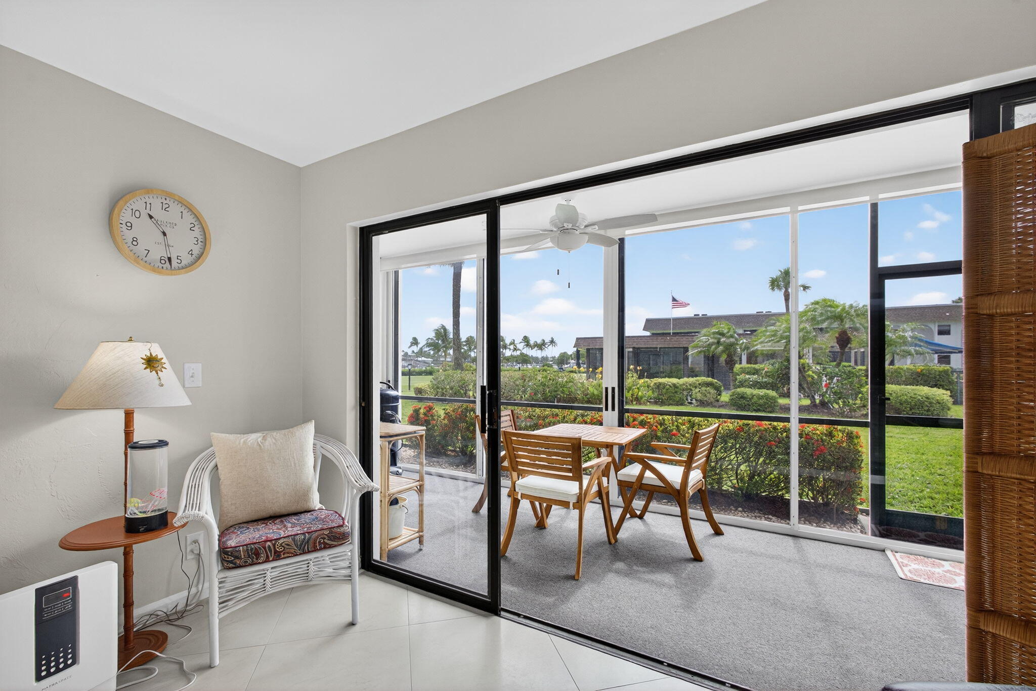755 Saturn Street, Unit C105 Jupiter, FL 33477 - Photo 16 of 36 a balcony with furniture and a large window