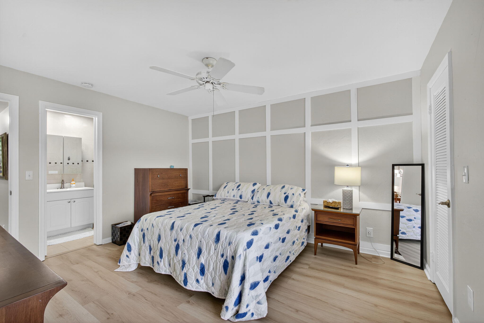 755 Saturn Street, Unit C105 Jupiter, FL 33477 - Photo 18 of 36 a bedroom with a bed and a table