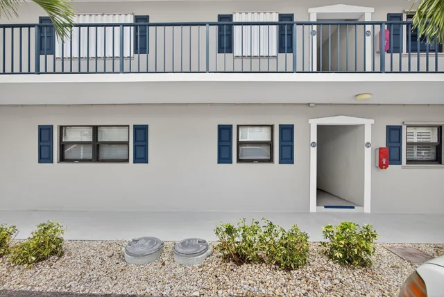 a large white kitchen with cabinets and stainless steel appliances