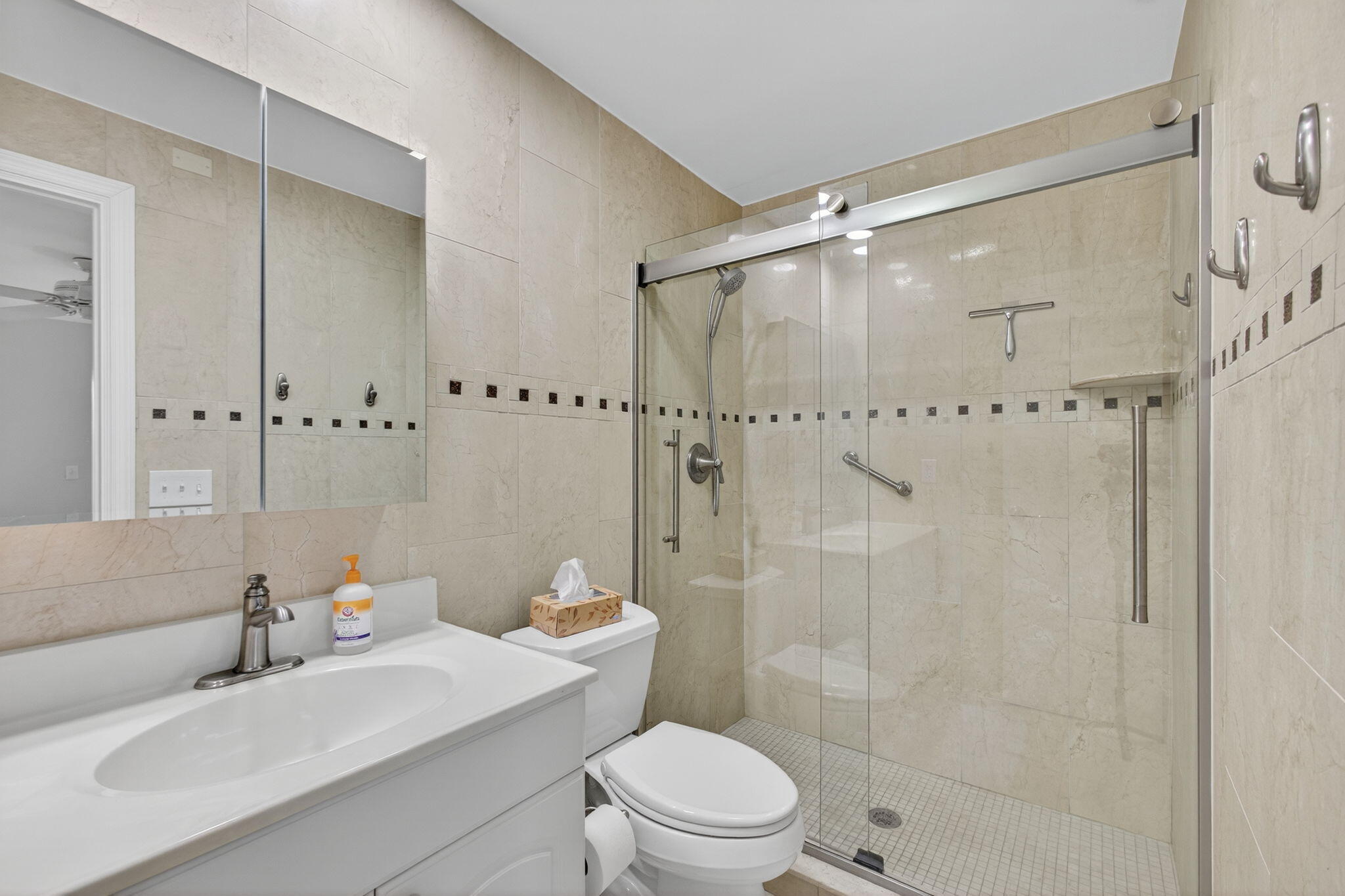 755 Saturn Street, Unit C105 Jupiter, FL 33477 - Photo 21 of 36 a bathroom with a sink toilet and shower