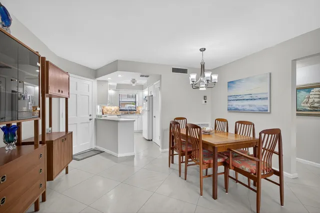 a view of a porch with furniture and a yard