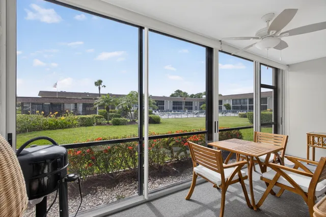 a view of a chairs and table in the patio