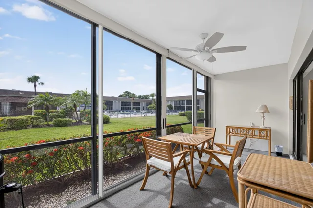 a view of house with backyard and garden