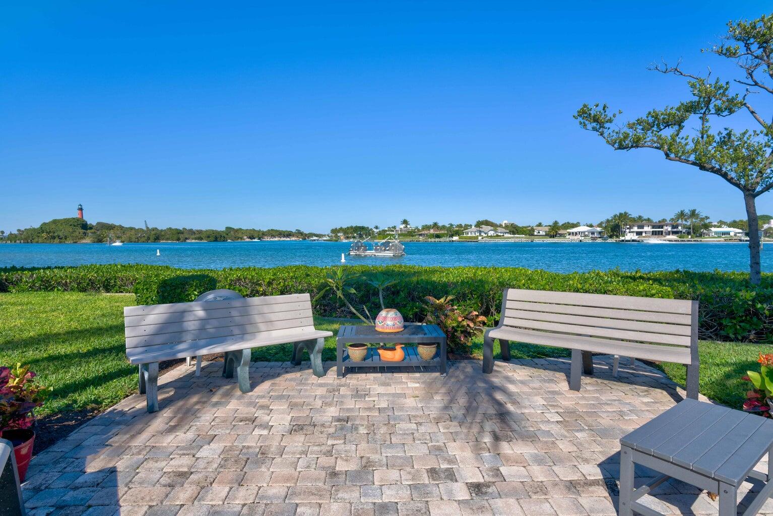 755 Saturn Street, Unit C105 Jupiter, FL 33477 - Photo 33 of 36 a bench sitting in the middle of a park