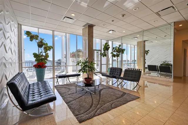 a kitchen with stainless steel appliances granite countertop a sink and a refrigerator