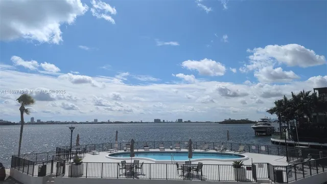 a view of kitchen with granite countertop stove top oven and microwave