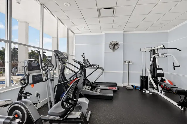 a view of swimming pool with outdoor seating and city view