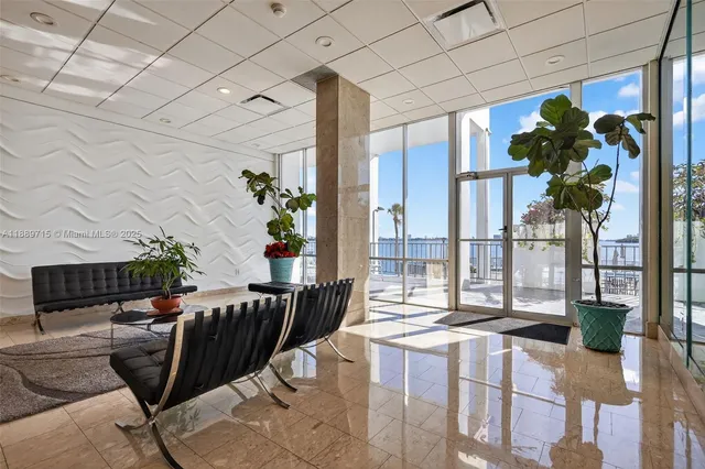 a living room with furniture wooden floor and a flat screen tv