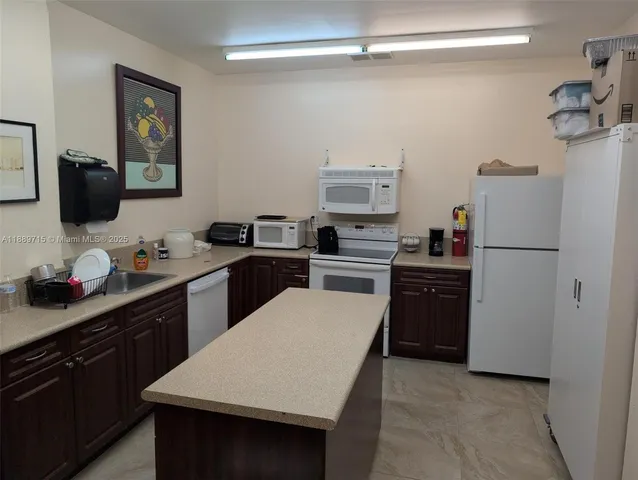 a view of a swimming pool with a yard and plants