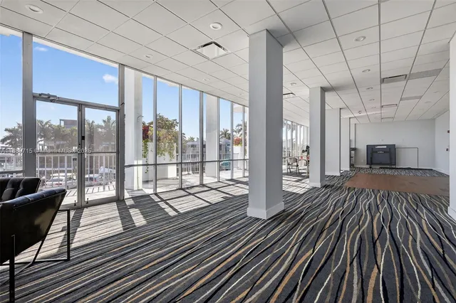 a view of a swimming pool and outdoor seating