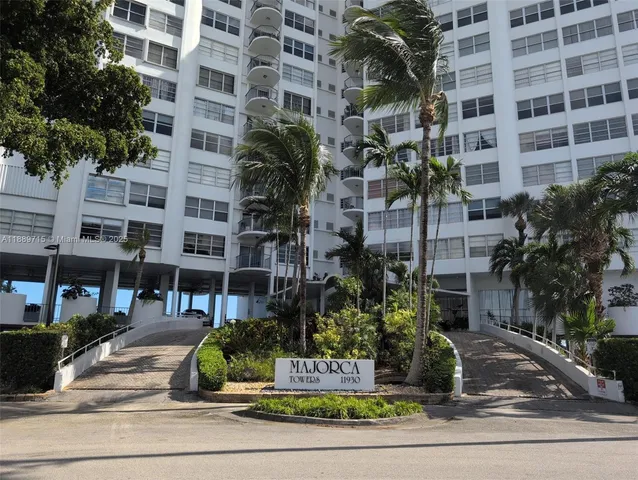 a view of a large body of water in middle of a field