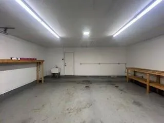 an empty room with a chair and dryer