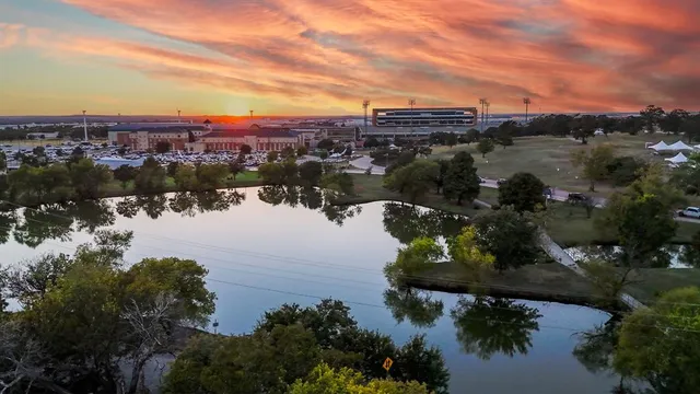 an aerial view of a house with a lake view