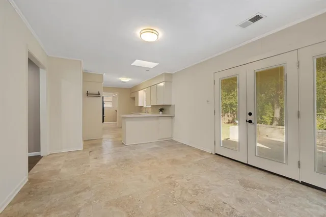 a view of a kitchen with a sink and cabinet