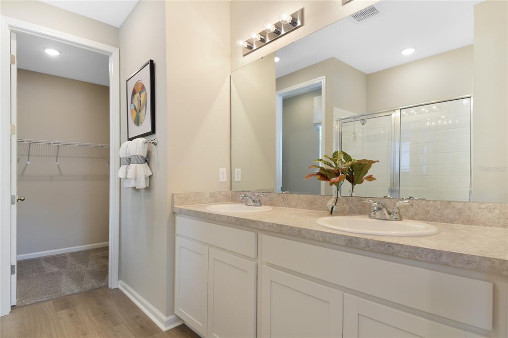 5331 Spring Maiden Circle Apollo Beach, FL 33572 - Photo 14 of 29 a bathroom with a double vanity sink and mirror