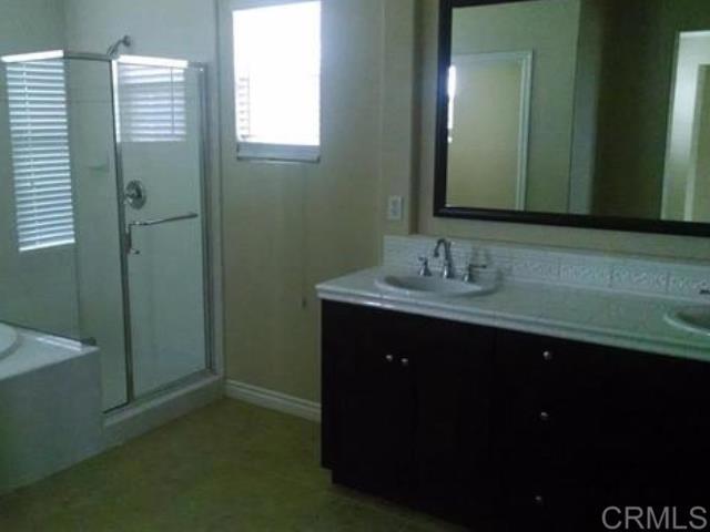 2692 Bressi Ranch Way Carlsbad, CA 92009 - Photo 4 of 4 a bathroom with a sink and a mirror