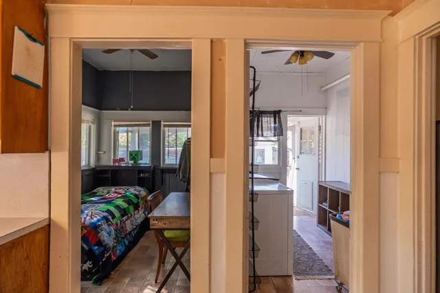 a view of entryway and hall with wooden floor