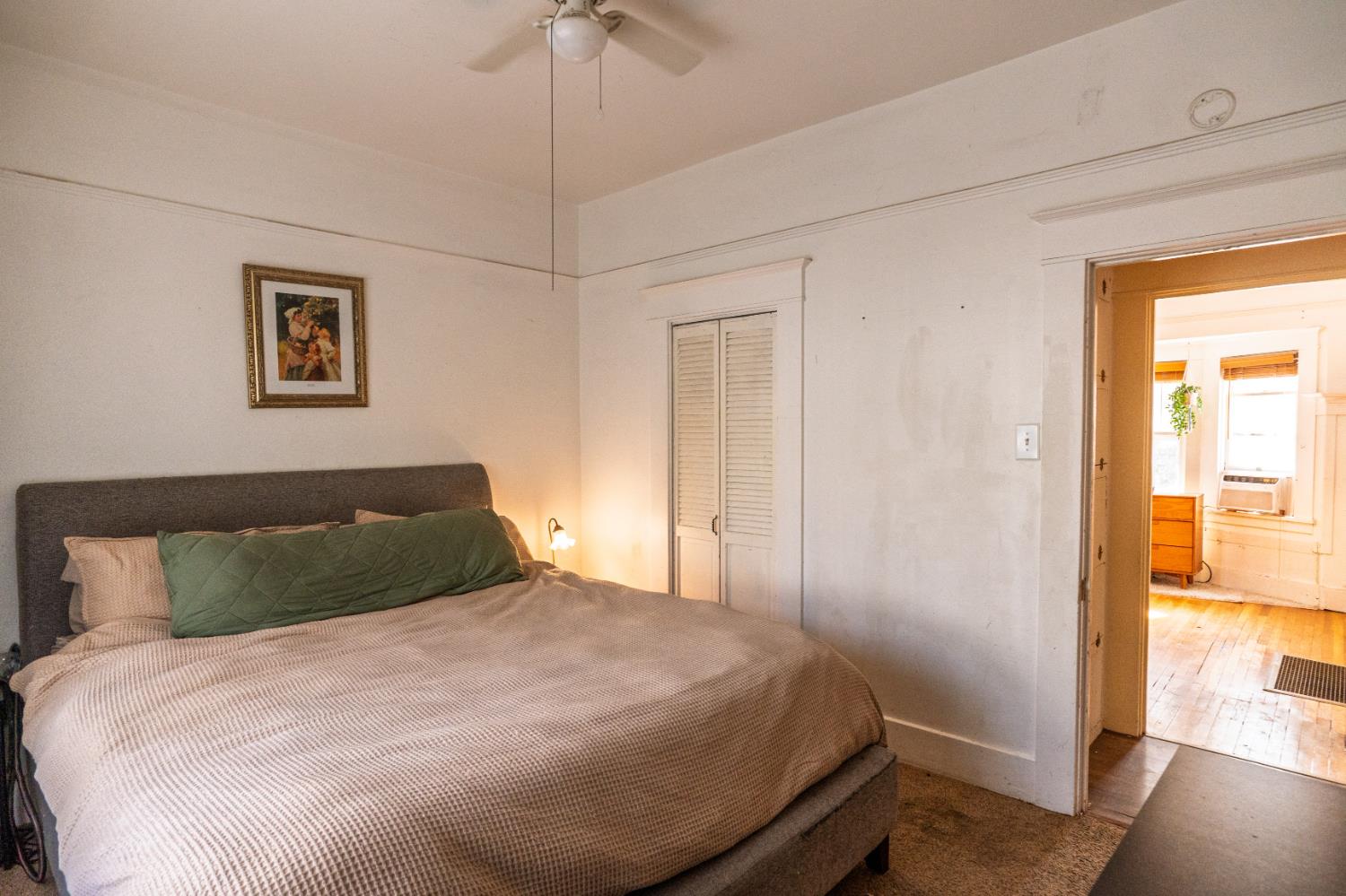 902 West 20th Street Merced, CA 95340 - Photo 17 of 48 a bedroom with a bed and wooden floor