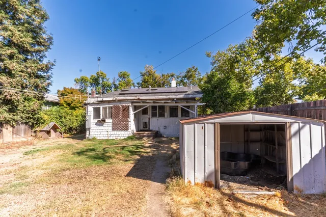 a view of a house with a tree