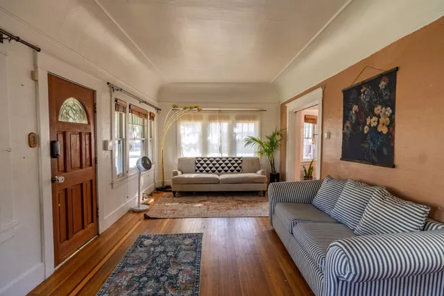 a living room with furniture and a rug