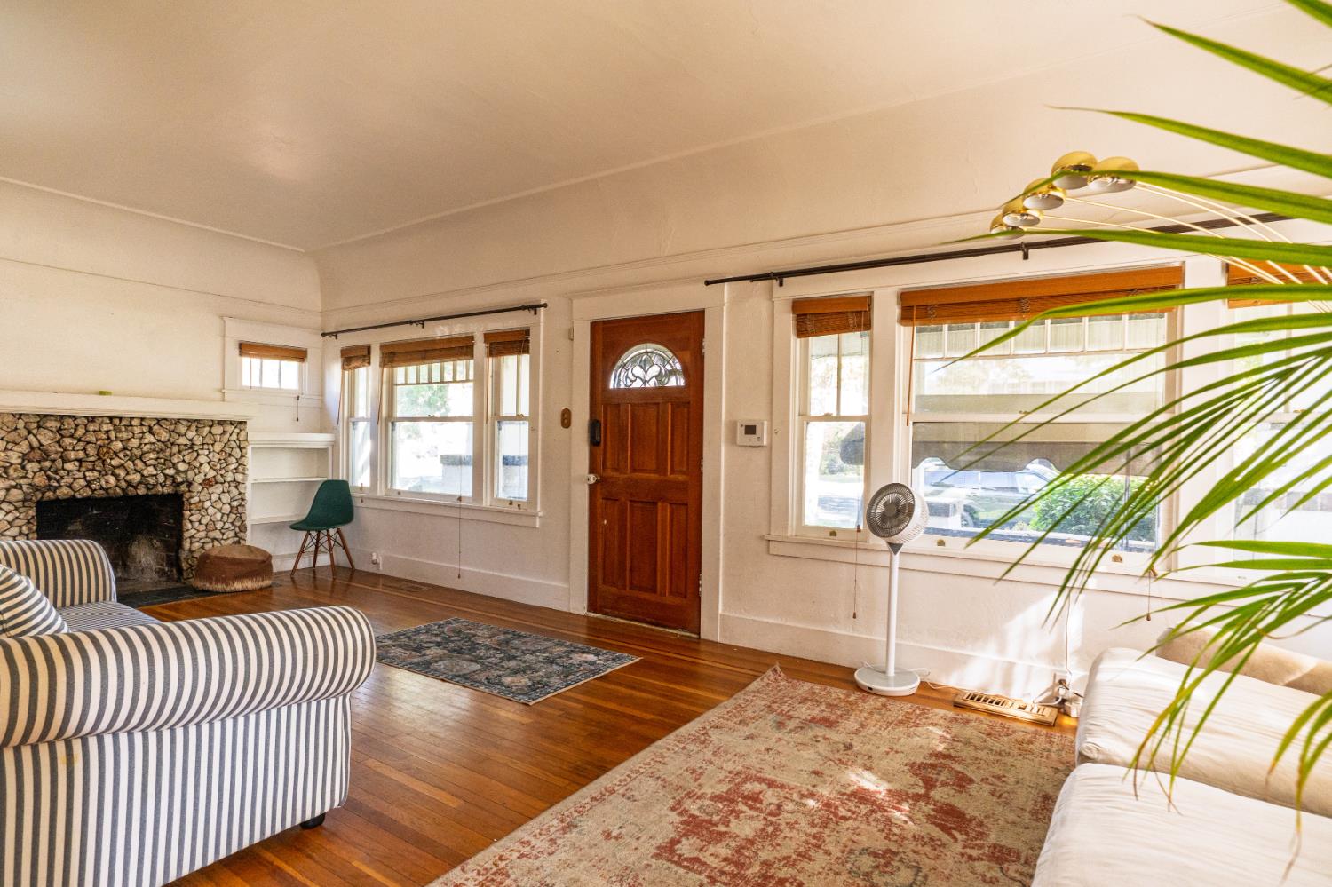 902 West 20th Street Merced, CA 95340 - Photo 5 of 48 a bedroom with furniture and a fireplace