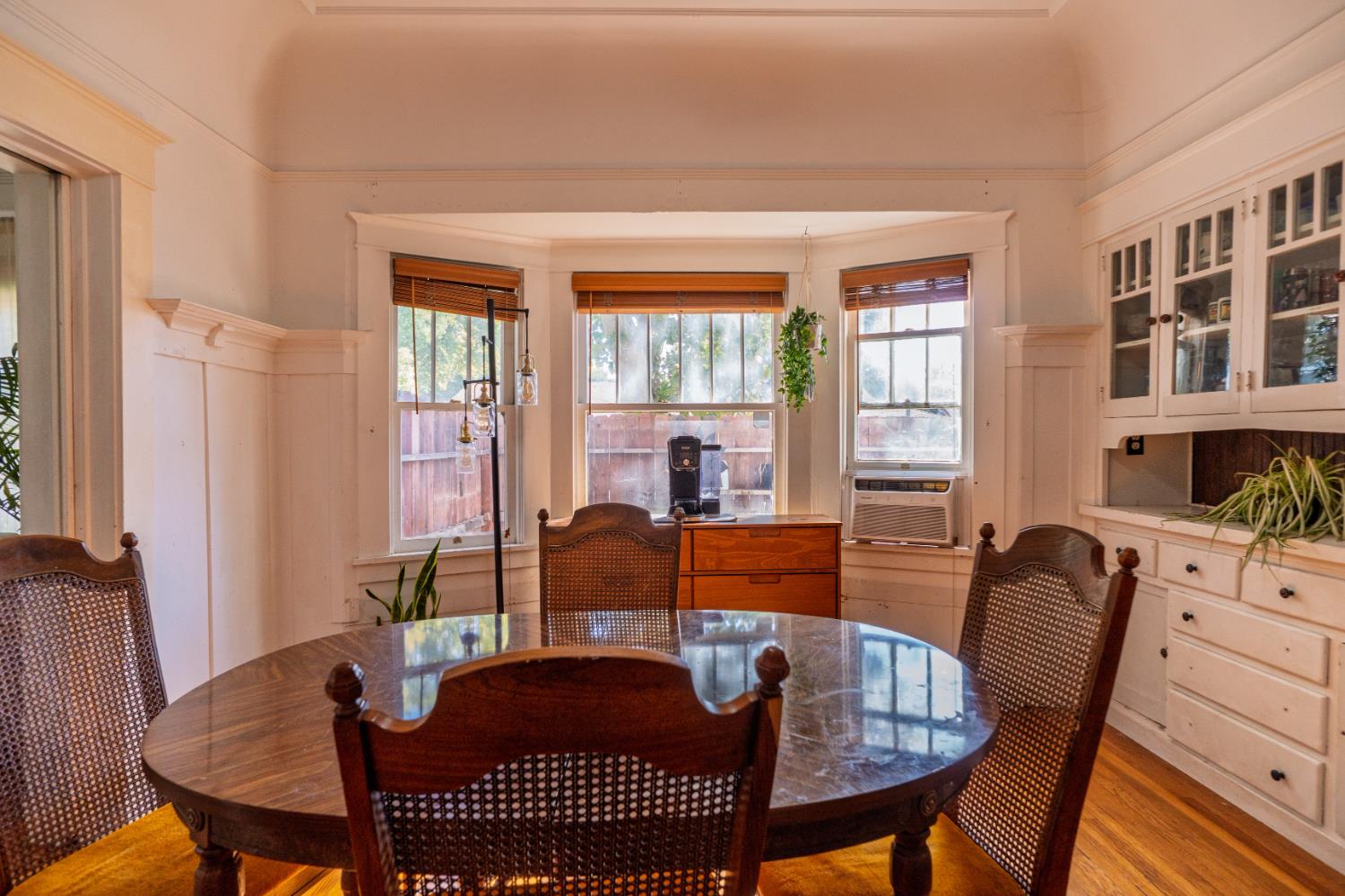 902 West 20th Street Merced, CA 95340 - Photo 7 of 48 a view of a dining room with furniture window and wooden floor