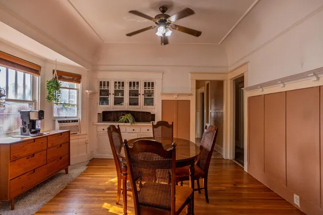a view of a dining room with furniture and window
