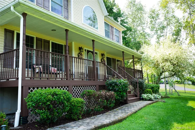 a view of balcony with wooden floor