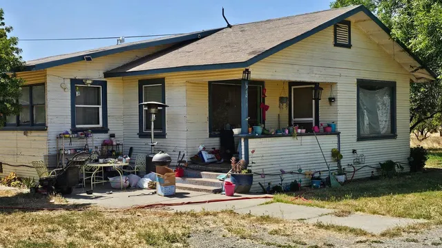 a view of the house with outdoor patio