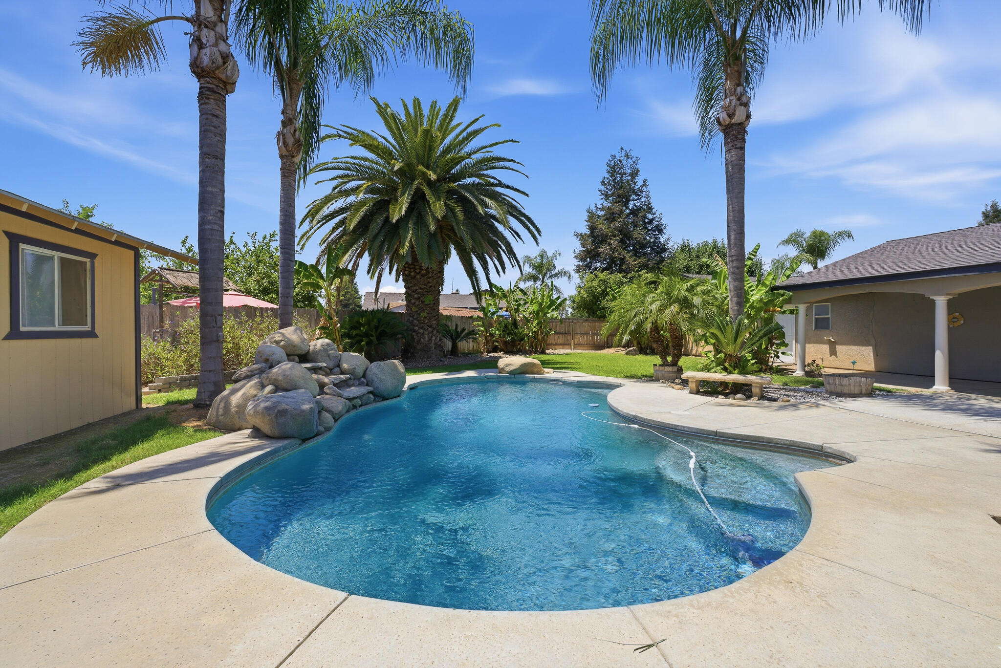 618 Birdsong Court Exeter, CA 93221 - Photo 53 of 62 a view of a backyard with palm trees