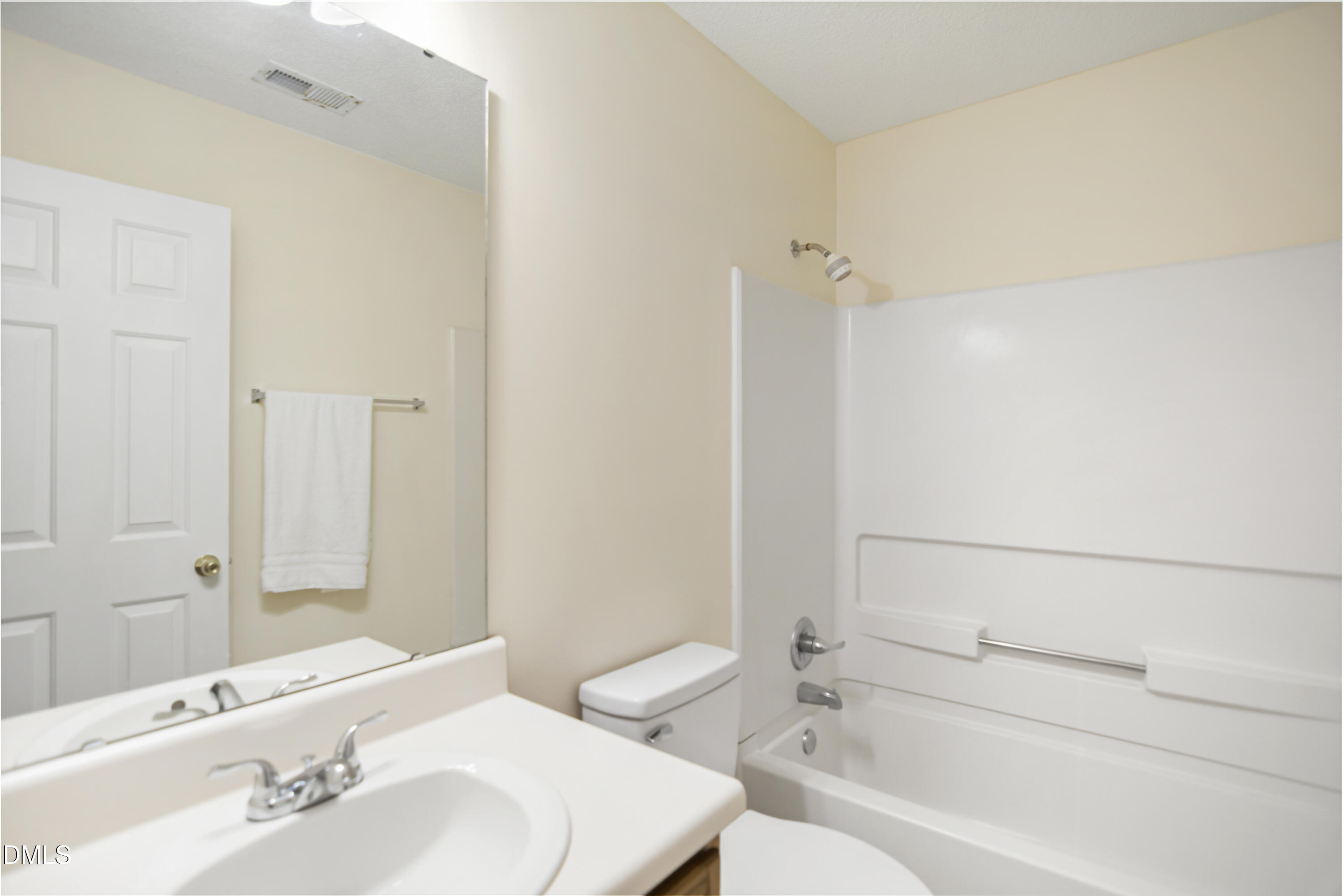 2241 Spruce Shadows Lane Raleigh, NC 27614 - Photo 26 of 29 a bathroom with a bathtub shower sink vanity and toilet