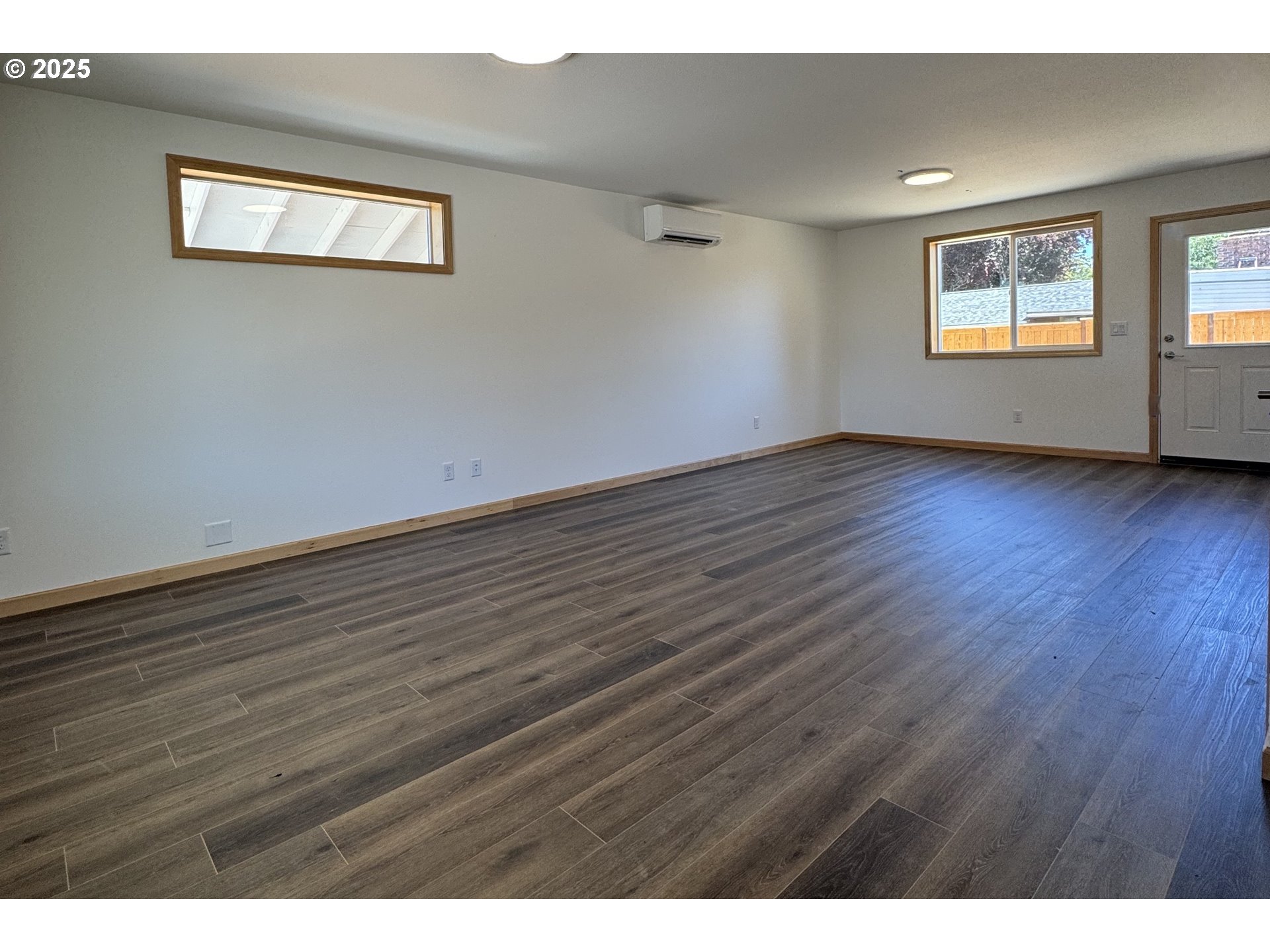 5260 Forest Lane Eugene, OR 97402 - Photo 8 of 17 a view of an empty room with wooden floor and a window