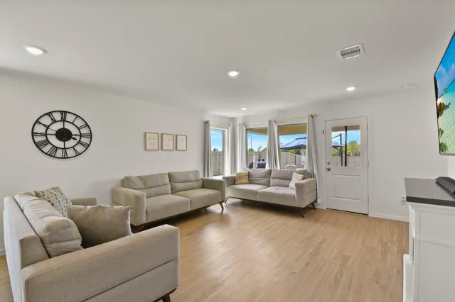 a living room with furniture and a large window