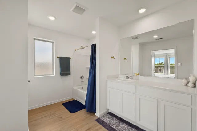a en suite bathroom with a sink and mirror